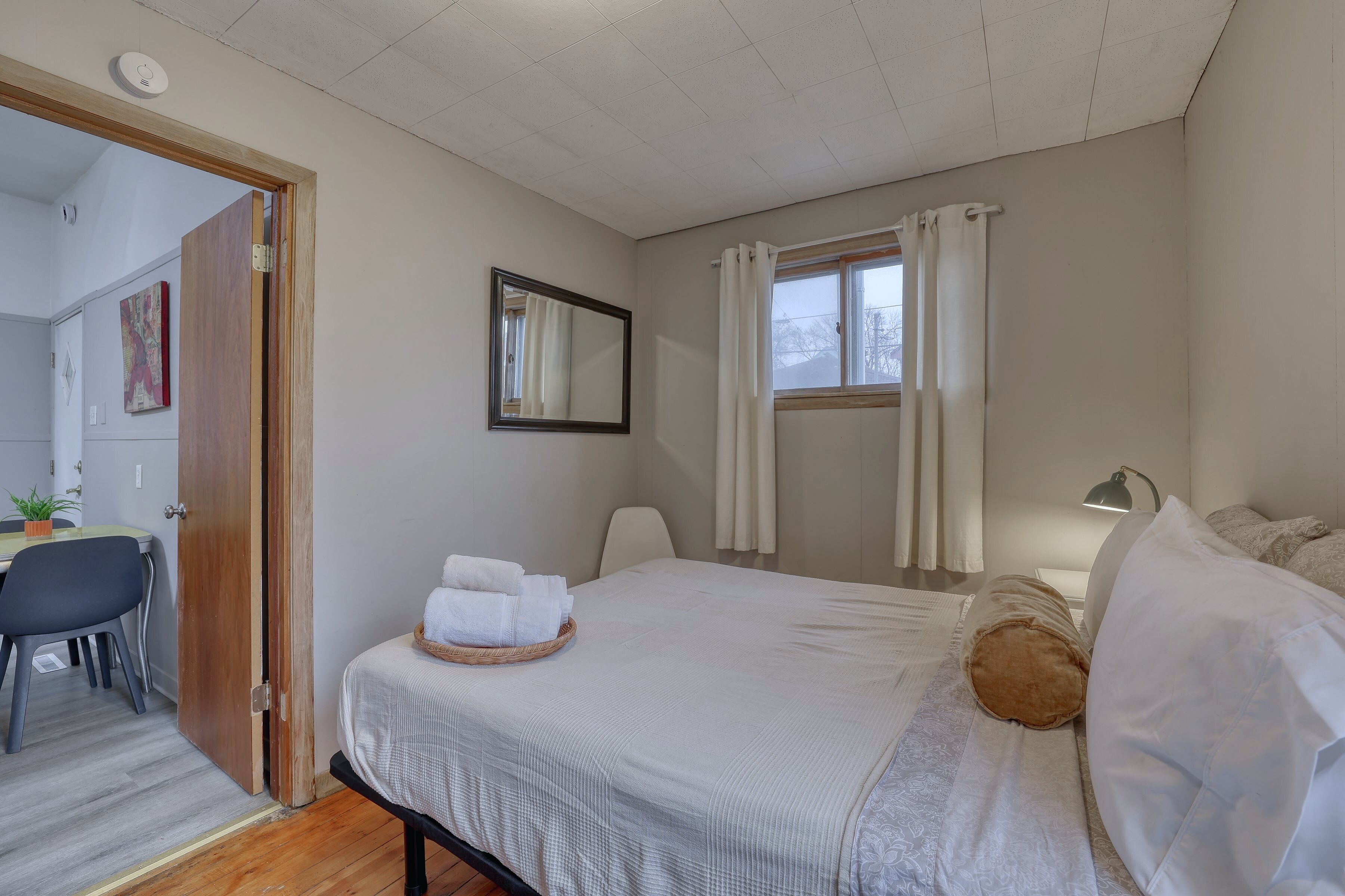 Second bedroom with dresser and armoire