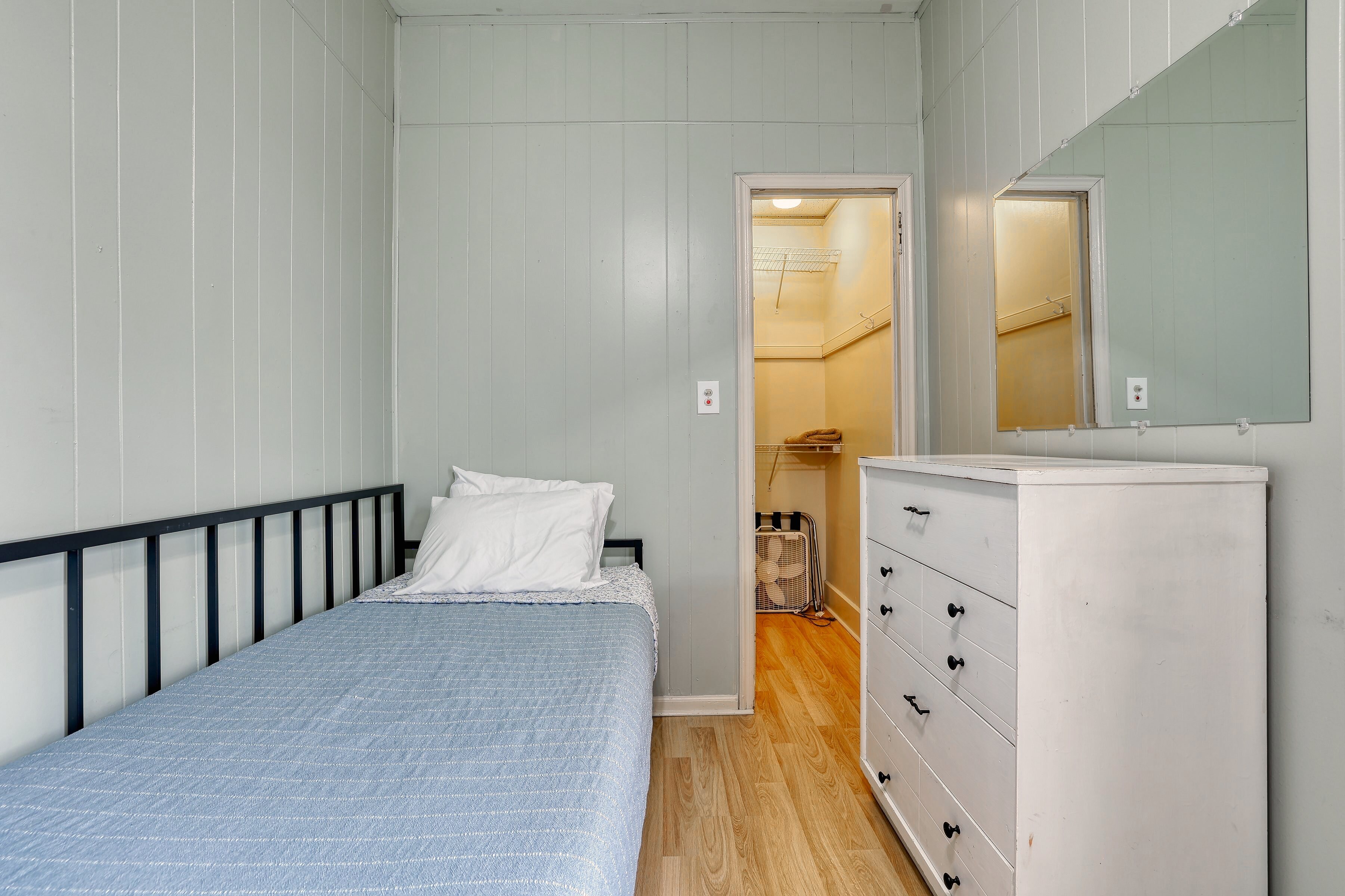 First floor third bedroom queen bed with window